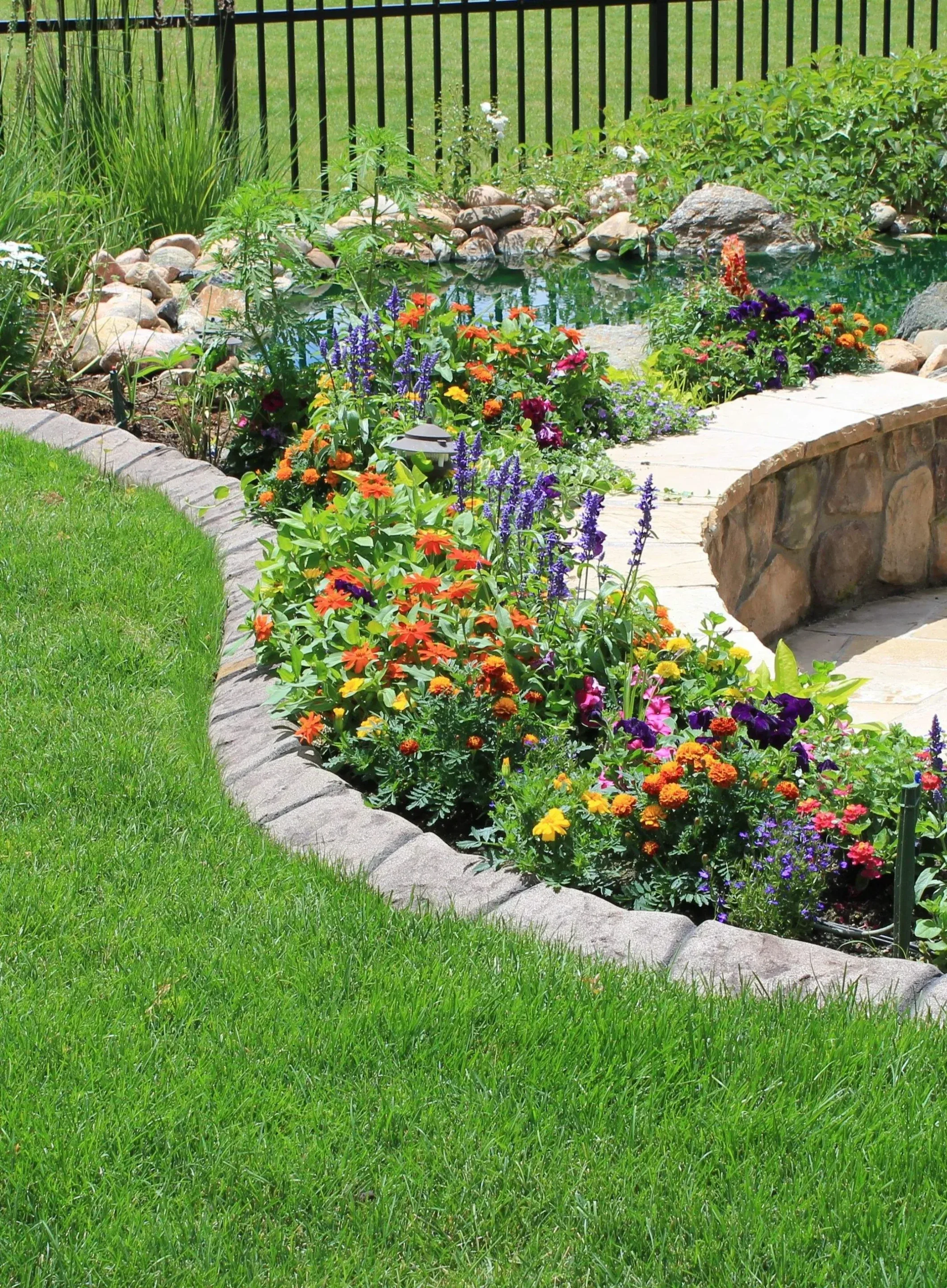 Straight curbing along driveway with ornamental grasses